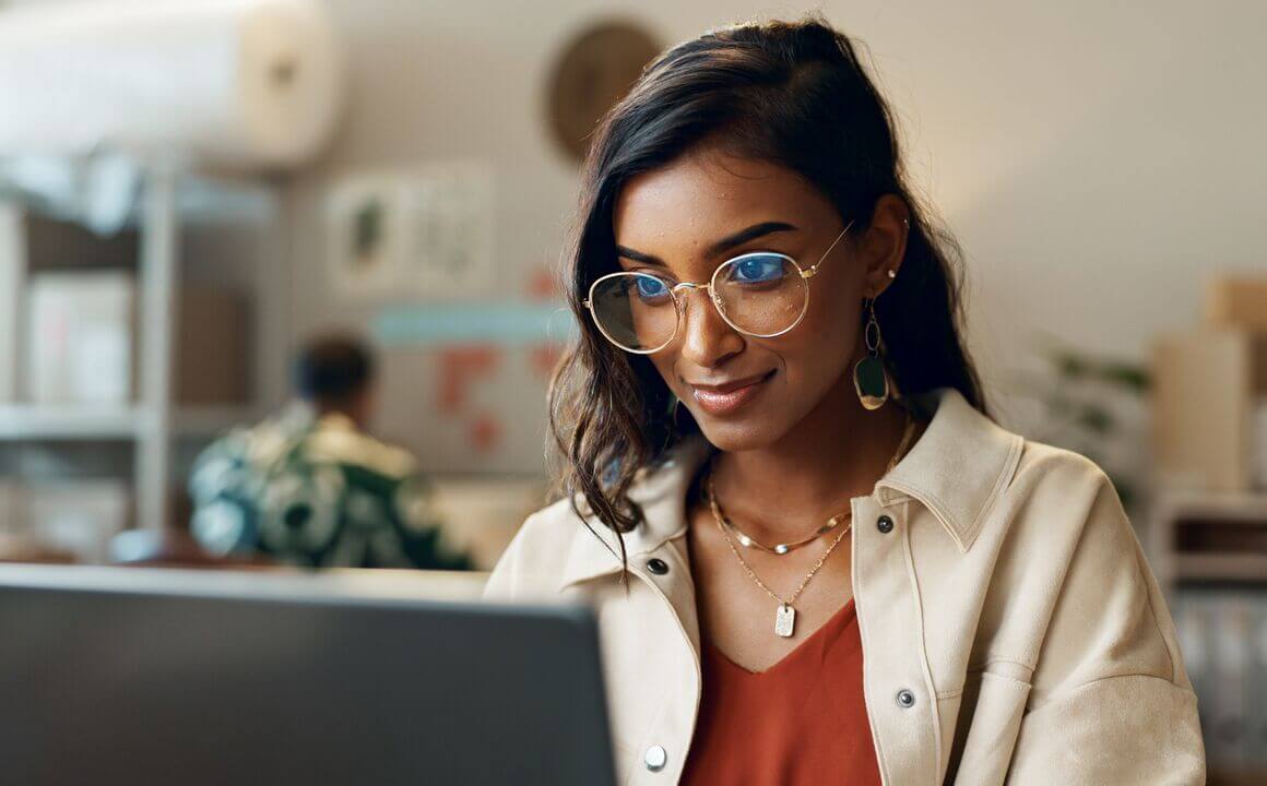 Business woman looking at laptop