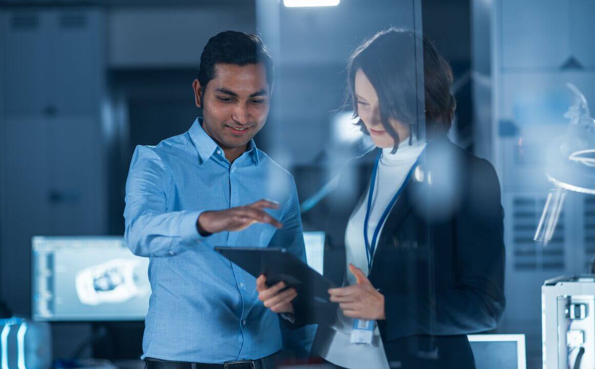 Business colleagues looking at a laptop.