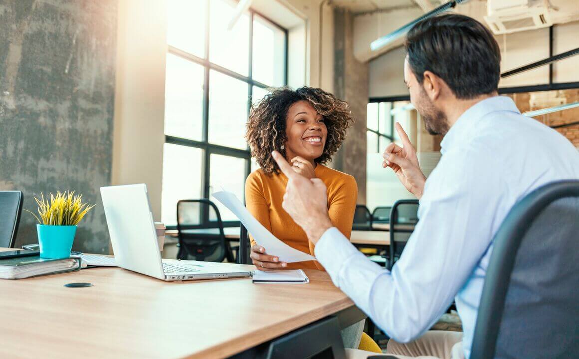 Two business colleagues talking